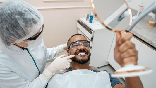 dentist showing patient teeth