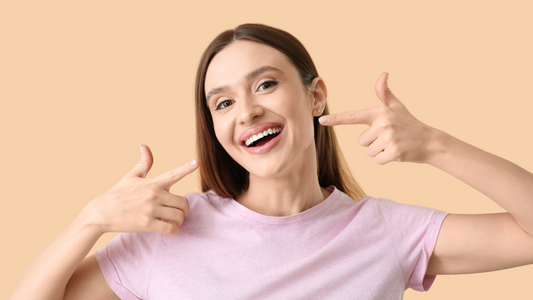 woman pointing at her smile